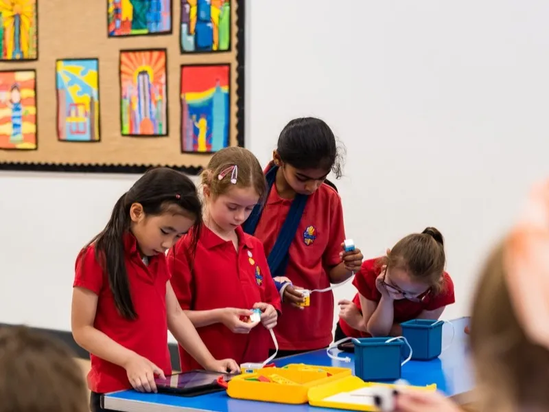 Students collaborating on a STEM project together