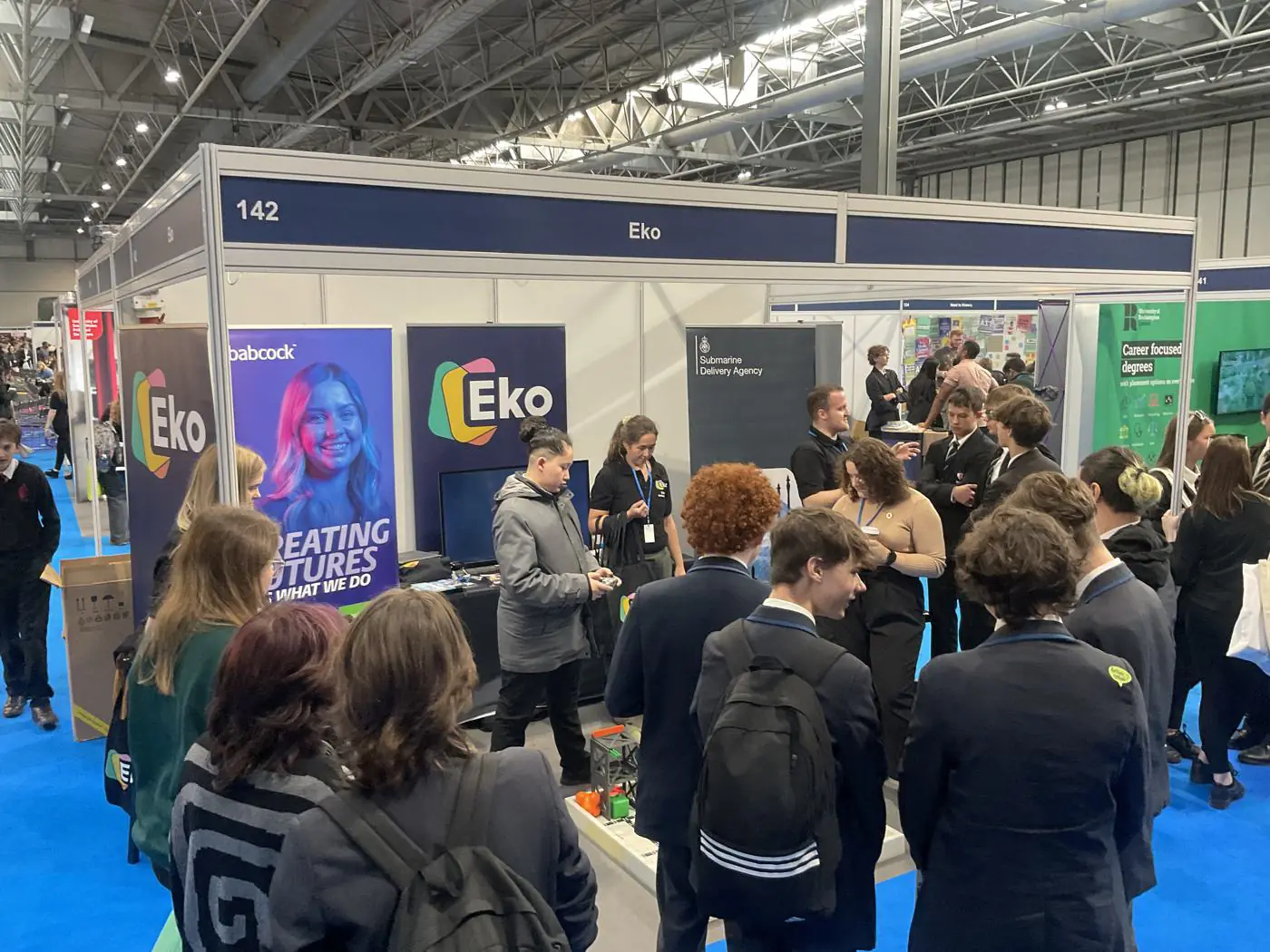 Students crowding the EKO stand at the NEC