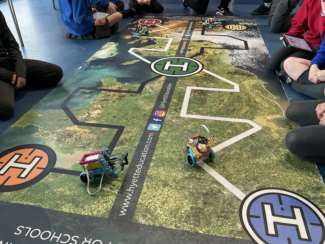 Coded robots on a challenge mat