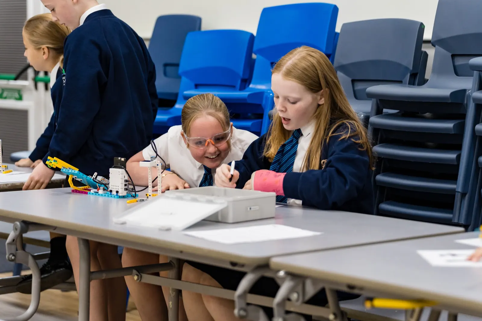 Two pupils testing their AI challenge build at an RAF Youth & STEM workshop