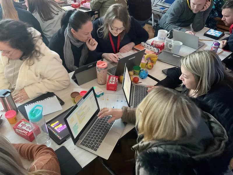 Teachers participating in hands-on professional development training session
