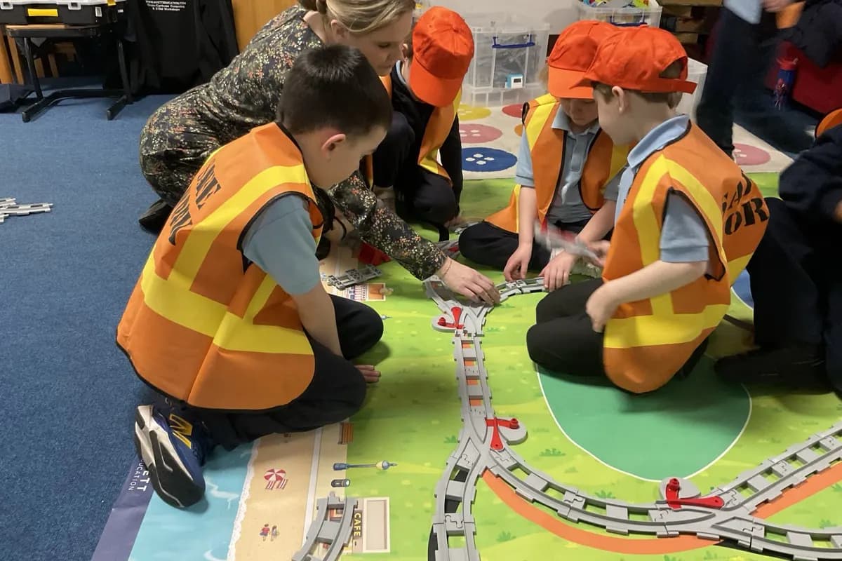 Young children building with LEGO SPIKE Essential kits during an Early Engineers workshop