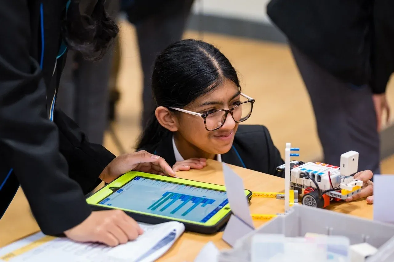Pupils exploring machine learning with a LEGO robot during a Hyett Education AI workshop