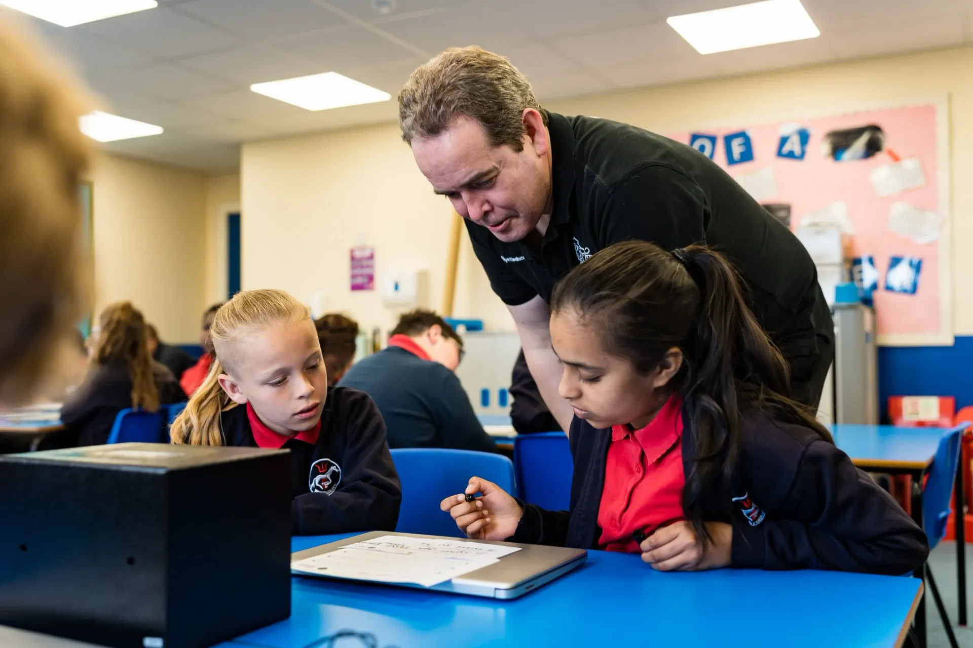 Pupils solving cryptography and codebreaking challenges during a Hyett Education cybersecurity workshop